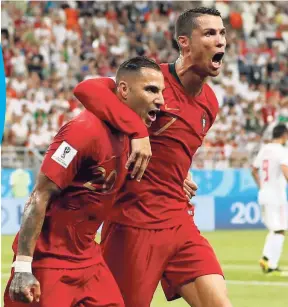  ?? AP ?? Portugal’s Ricardo Quaresma (left) celebrates his goal with teammate Cristiano Ronaldo during their 1-1 draw with Iran in Group B of the FIFA World Cup at the Mordovia Arena in Saransk, Russia, yesterday.