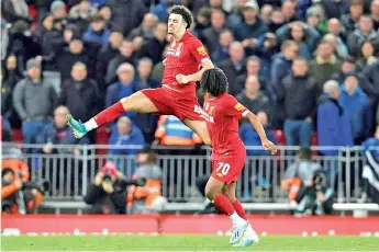  ?? - AFP photo ?? Liverpool’s Curtis Jones (L) celebrates his superb winner against Everton in the FA Cup.