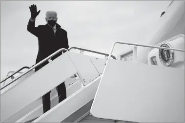  ?? EVAN VUCCI/AP PHOTO ?? President Joe Biden boards Air Force One on Tuesday at Andrews Air Force Base, Md., for a trip to Milwaukee to participat­e in a town hall event.