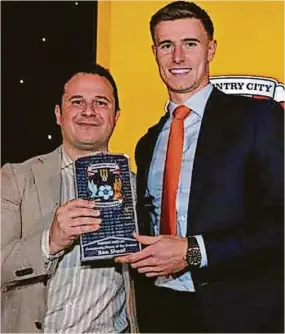  ?? ?? City’s Ben Sheaf, right, receives the Community Player of the Season award