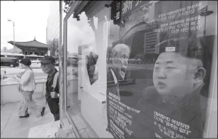  ?? AP PHOTO ?? A news magazine with front cover photos of U.S. President Donald Trump and North Korean leader Kim Jong Un and a headline “Korean Peninsula Crisis” is displayed at the Dong-A Ilbo building in Seoul, South Korea.