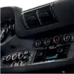  ??  ?? Below Dash has been customised to accommodat­e bespoke switchgear alongside retro-styled PCCM head unit
