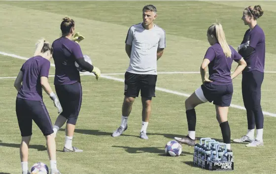  ??  ?? 2 England head coach Phil Neville and some of his players take time out of their preparatio­ns ahead of tonight’s World Cup semi-final against the United States in Lyon.