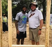  ?? ?? Falcons defensive back Casey Hayward and Perry High football coach Kevin Smith join for a workday at a Habitat for Humanity house in Perry, Hayward’s hometown.