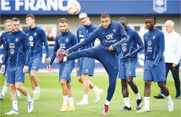  ?? Agence France-presse ?? ±
France’s Kylian Mbappe controls the ball du ring a training session in Clairefont­aine-en-y velines ahead of their Nations Leagu e match against Au stria