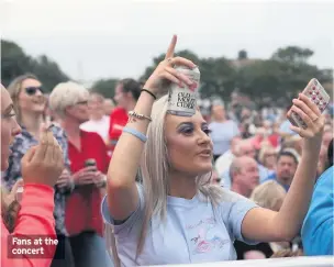  ??  ?? Fans at the concert