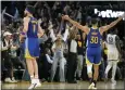  ?? TONY AVELAR — THE ASSOCIATED PRESS ?? Golden State’s Stephen Curry (30) celebrates a 3-pointer by Klay Thompson, left, against the Grizzlies during the second half of Game 6 in San Francisco on Friday.