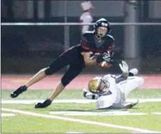  ?? Photograph­s courtesy of Stephanie Harwell ?? Berryville managed to drive into Blackhawk territory in the final minute of the half, with a Bobcat pass seemingly headed for a Berryville score until senior Mason Harwell stepped in front of it for a drive-killing intercepti­on.