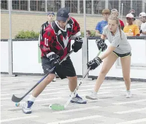  ?? PATRICK DOYLE ?? Players take part in the annual Ottawa Ball Hockey Tournament at Lansdowne Park in Ottawa last August. Hockey of any form remains an obsession in Canada for both young and old.