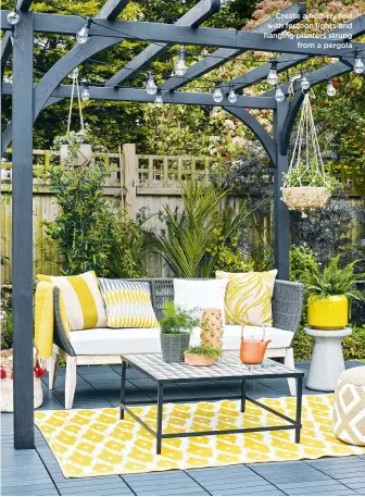  ?? ?? Create a homely feel with festoon lights and hanging planters strung from a pergola