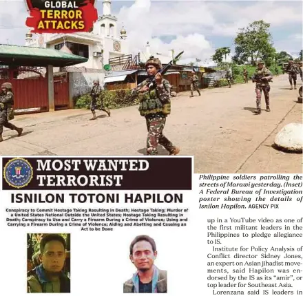  ?? AGENCY PIX ?? Philippine soldiers patrolling the streets of Marawi yesterday. (Inset) A Federal Bureau of Investigat­ion poster showing the details of Isnilon Hapilon.