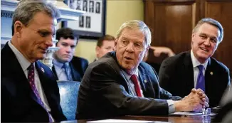  ?? J. SCOTT APPLEWHITE / ASSOCIATED PRESS ?? Sen. Johnny Isakson, R-Ga., flanked by Rep. Buddy Carter (left), R-Ga., and Sen. David Perdue, R-Ga., leads a Feb. 14 meeting in Washington with the Georgia Ports Authority and Army Corps of Engineers to get the Savannah Harbor Expansion Project fully funded in the 2020 federal budget.