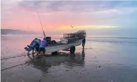  ?? Photograph: Laura Paddison ?? Another day’s fishing in calm waters at San Juanico on the coast of north-west Mexico … but a storm has long been brewing.