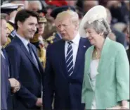  ?? ANDREW MATTHEWS — PA VIA AP ?? Canadian Prime Minister Justin Trudeau, U.S. President Donald Trump and Britain’s Prime Minister Theresa May attend commemorat­ions for the 75th Anniversar­y of the D-Day landings Wednesday in Portsmouth, England.