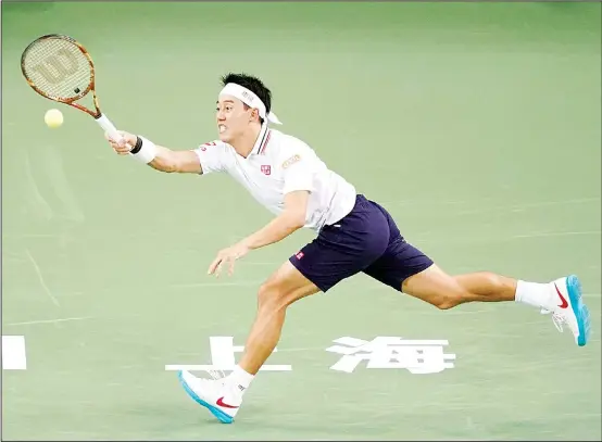  ??  ?? Kei Nishikori of Japan hits a return against Wu Yibing of China during their men’s singles second round match at the Shanghai Masters tennis tournament on October 10. (AFP)