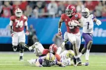  ?? STREETER LECKA/GETTY IMAGES ?? Bo Scarbrough, (9) of Alabama, breaks away for a long touchdown against Washington during the Peach Bowl on Saturday.