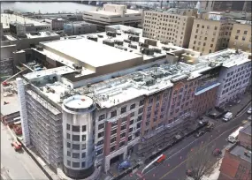  ?? Patrick Johnson / Associated Press ?? This April 24 aerial photo shows constructi­on progress on the MGM Casino complex in Springfiel­d, Mass., which is on track to open in August, a few weeks ahead of schedule.