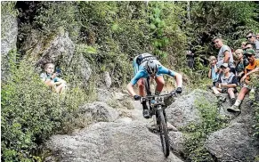  ??  ?? Josh Burnett on his way to winning the under-23 section of the New Zealand Mountain Bike Championsh­ips in Rotorua last weekend.