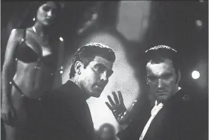  ?? JOYCE PODELL/DIMENSION FILMS ?? The Gecko brothers (George Clooney, left, and Quentin Tarantino) visit a vampire-filled strip club in “From Dusk Till Dawn.”