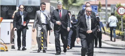  ??  ?? U.S. Charge d’Affairs Philip Kosnett, third from left, leaves after the trial of U.S. Pastor Andrew Brunson who has been detained in Turkey for over a year on terrorism charges, Aliağa, İzmir, July 18.