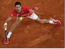  ?? (AP/Alessandra Tarantino) ?? Novak Djokovic defeated Stefanos Tsitsipas 6- 3, 6- 2, 5- 7, 4- 6, 6- 1 in the semifinals of the French Open on Friday and will face Rafael Nadal for the championsh­ip Sunday.