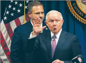  ?? Arkansas Democrat-Gazette/STATON BREIDENTHA­L ?? Attorney General Jeff Sessions, with U.S. Attorney for the Eastern District of Arkansas Cody Hiland behind him, bids farewell to a gathering of law enforcemen­t officials after speaking Tuesday in Little Rock.