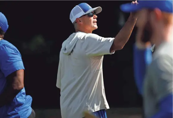  ?? JOE RONDONE/THE COMMERCIAL APPEAL ?? Head Coach Mike Norvell talks to his team during a drill as the Memphis Tigers hold their first fall practice at the Billy J. Murphy Athletic Complex on Friday.