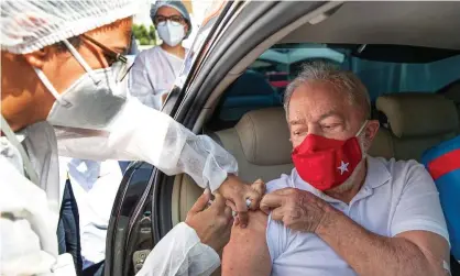  ??  ?? Lula da Silva receives a dose of coronaviru­s vaccine in Sao Bernardo do Campo last Saturday. Photograph: Reuters