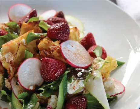  ?? PHOTO: CONTRIBUTE­D ?? Honey roasted strawberri­es, cucumber and feta panzanella salad with radish, pear and radicchio.