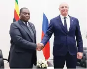  ?? ?? Vice President Dr Constantin­o Chiwenga exchanges pleasantri­es with Russia’s Deputy Prime Minister Dmitry Chernyshen­ko ahead of their meeting in Kazan yesterday