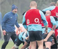  ?? AFP ?? England coach Steve Borthwick, left, watches his players train.