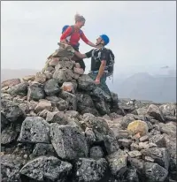  ??  ?? Stuart Clark seals romance forged on the hills by proposing to Fiona on Buachaille Etive Mor
