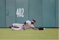  ?? Associated Press ?? Texas Rangers center fielder Delino DeShields misses a line drive by Washington Nationals' Daniel Murphy for a single during the fourth inning of a baseball game Friday in Washington.