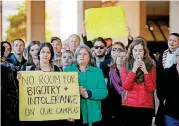  ?? [PHOTO BY BRYAN TERRY, THE OKLAHOMAN] ?? University of Oklahoma students and others hold signs to protest controvers­ial remarks by Vice Chairman Kirk Humphreys before start of OU Board of Regents meeting Tuesday in Oklahoma City.