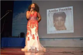  ?? BRIANA CONTRERAS — THE MORNING JOURNAL ?? Myjia Brown, an 11th-grade student at Horizon Science Academy of Lorain, performs as Aretha Franklin on Feb. 22 during a Black History Month Awards Show at the school.