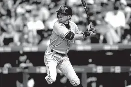  ?? Associated Press ?? Miami Marlins’ Ichiro Suzuki waits for the pitch that he hit for a triple during the seventh inning Sunday in Denver. The hit was the 3,000th in his Major League career.