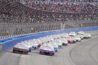  ?? JAE C. HONG/ASSOCIATED PRESS ?? Ross Chastain (1) leads during Sunday’s NASCAR Cup Series race at Auto Club Speedway in Fontana, California. Sunday’s race served as a goodbye of sorts for a track beloved by drivers and fans alike.