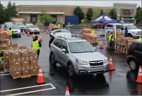  ?? PHOTO COURTESY PAULA SCHAFER ?? MAHN distribute­s food boxes to the community on May 28 at Willow Grove Park Mall in collaborat­ion with Montgomery County Department of Public Safety, and RSVP Montgomery County. More than 1,000 households were served at this event.