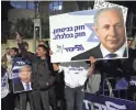  ?? ABIR SULTAN/EPA-EFE ?? Supporters of Israeli Prime Minister Benjamin Netanyahu protest in Jerusalem against the decision to prosecute him.