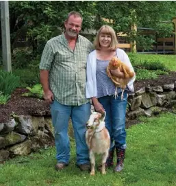  ??  ?? Above: Bob and Catherine, along with Fiona the goat and a friendly chicken, explore their bucolic 9-acre property.