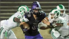  ?? BEA AHBECK/NEWS-SENTINEL ?? Tokay's Joshua Kirchner is taken down by St. Mary's Asar-alim Moore and Rick Telitz during their game at the Grape Bowl on Oct. 6, 2017.