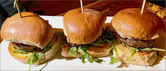  ?? Photos by Susie Davidson Powell / For the Times Union ?? Lamb sliders at The City Beer Hall are topped with Taleggio, arugula, balsamic aioli and fig mostarda.