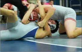  ??  ?? Owen J. Roberts’ Jason Zollers pinned his opponent in 1:18 during the Wildcats’ victory over Pottstown Wednesday night.