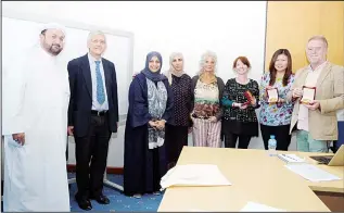  ??  ?? HIIMD staff of Kuwait University pose with Swansea University team.