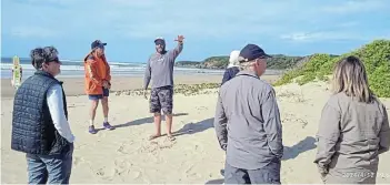  ?? Picture: MIKE LOEWE ?? TOURISM SQUANDERED: A group of internatio­nal tourists off cruise liner Silver Cloud are in awe of Nahoon Point Nature Reserve on Friday. Within hours the beach was a polluted disaster and there area was closed.