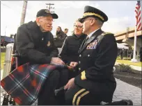  ?? Christian Abraham / Hearst Connecticu­t Media ?? Floyd Welch of East Lyme, who survived the attack on Pearl Harbor, speaks to Connecticu­t National Guard Maj. Gen. Fran Evon, right, at the Pearl Harbor Memorial Park dedication in New Haven Thursday.