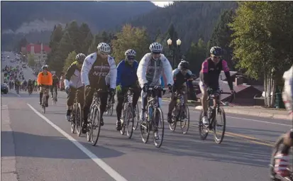  ?? Courtesy photo ?? Riders tackle an uphill climb during a prior Enchanted Circle Century.