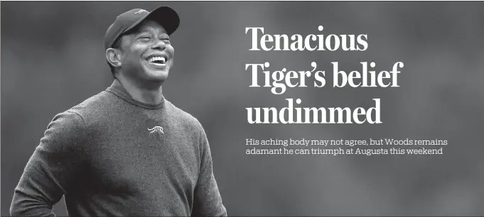  ?? GETTY IMAGES VIA AFP ?? Tiger Woods is all smiles during a practice round on Tuesday ahead of the Masters at Augusta National Golf Club in Georgia.