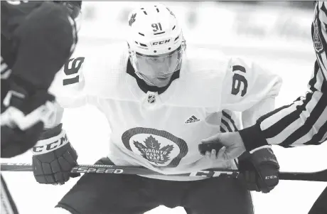  ?? DAVEABEL ?? Toronto centre John Tavares prepares for a faceoff during the Maple Leafs’ first day of training camp on Friday in Niagara Falls, Ont. The free-agent acquisitio­n commanded much of the attention during the scrimmage, showcasing his skill immediatel­y alongside winger Mitch Marner.