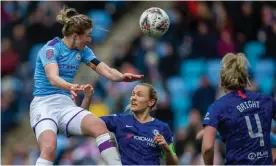  ?? Photograph: Tim Williams/Action Plus/Shuttersto­ck ?? Ellen White of Manchester City Women outjumps the Chelsea defence. City are the leaders of the WSL.